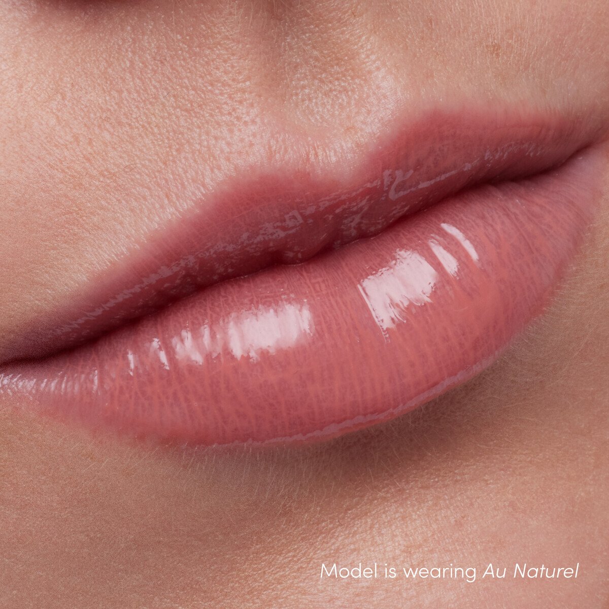 Jane Iredale ColorLuxe High Impact Lip Glaze, shade Au Naturel, on lips